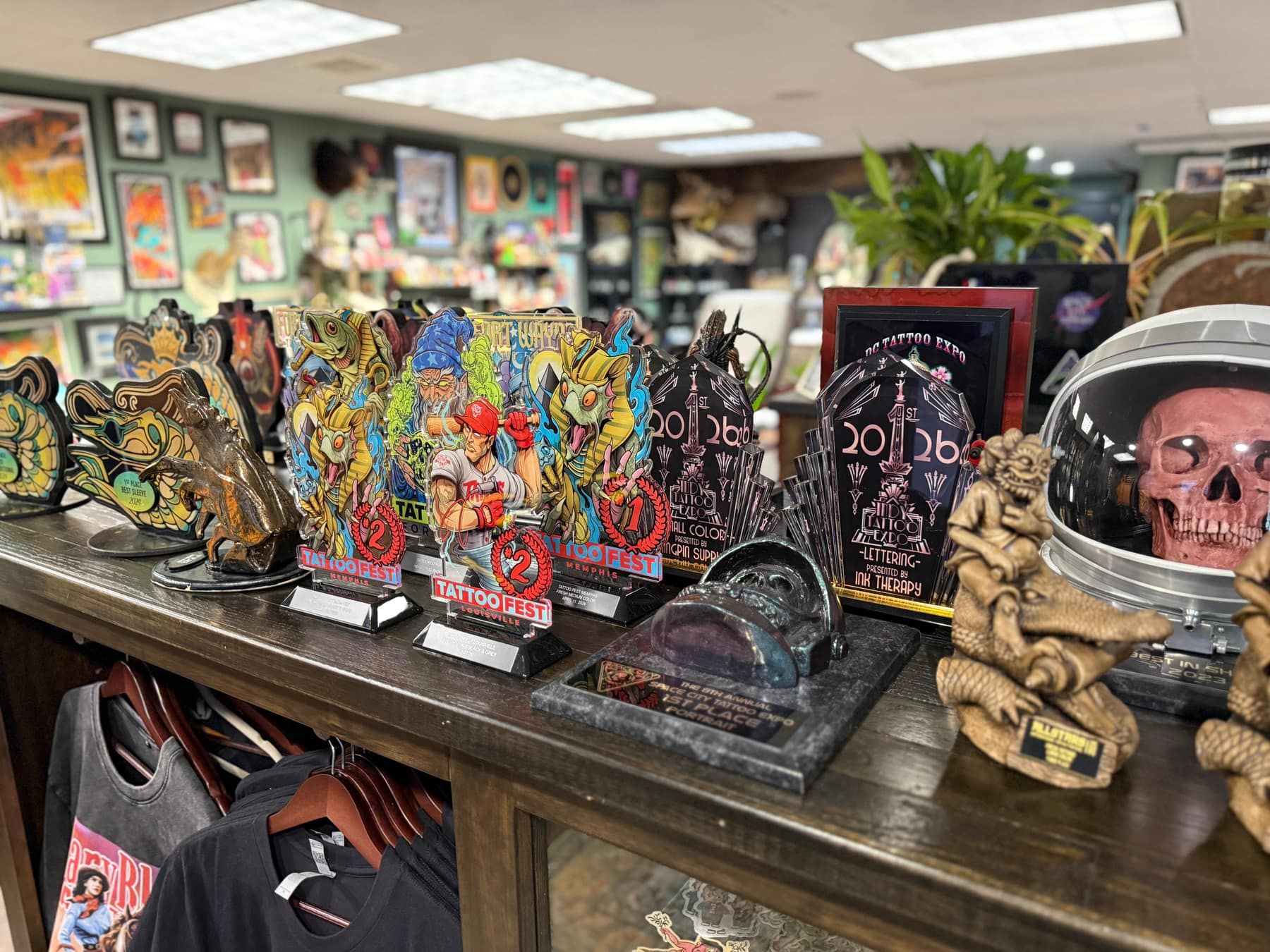 Tattoo convention trophies and oddities displayed on the front counter